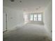 Expansive living room with abundant natural light and an open layout, ideal for comfortable living and gatherings at 13540 Autumn Harvest Ave, Winter Garden, FL 34787