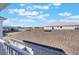 View from balcony of new roof installation over a new community under construction on a sunny day at 13540 Autumn Harvest Ave, Winter Garden, FL 34787