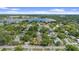 Expansive aerial view of charming neighborhood near a serene lake, highlighting lush greenery at 1440 Roosevelt St, Orlando, FL 32804