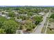 An aerial view of a beautiful single-Gathering home with lush greenery, trees, and a skyline view at 1440 Roosevelt St, Orlando, FL 32804