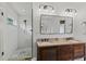 Bright bathroom featuring double sinks, glass shower, and modern vanity at 1440 Roosevelt St, Orlando, FL 32804