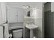 Small bathroom featuring a toilet, pedestal sink, and walk-in shower, offering practicality in a compact space at 1440 Roosevelt St, Orlando, FL 32804