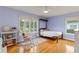 Bedroom with hardwood floors, natural light, and purple walls at 1440 Roosevelt St, Orlando, FL 32804