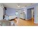 Cozy bedroom with a ceiling fan, hardwood floors, and a light blue painted walls at 1440 Roosevelt St, Orlando, FL 32804
