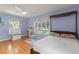 Bright bedroom with a ceiling fan, hardwood floors, and large windows at 1440 Roosevelt St, Orlando, FL 32804