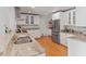 Updated kitchen with stainless appliances, granite countertops, and natural wood floors at 1440 Roosevelt St, Orlando, FL 32804