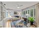 Bright living room with desk, hardwood floors, and built-in shelving at 1440 Roosevelt St, Orlando, FL 32804