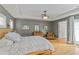 Comfortable main bedroom with natural light, hardwood floors, and en-suite bath at 1440 Roosevelt St, Orlando, FL 32804