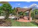 Charming brick patio with pergola, dining area, and garden, perfect for outdoor entertaining at 1440 Roosevelt St, Orlando, FL 32804