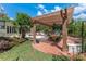 Charming brick patio with pergola, dining area, and garden, perfect for outdoor entertaining at 1440 Roosevelt St, Orlando, FL 32804