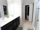 Bathroom featuring a double sink vanity, walk-in shower, and a walk-in closet at 146 Loblolly Ln, Davenport, FL 33837