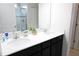 Bathroom featuring a double sink vanity and walk-in shower at 146 Loblolly Ln, Davenport, FL 33837