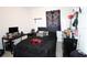 The bedroom features carpet floors, a ceiling fan, and is decorated with a dragon-themed wall hanging at 146 Loblolly Ln, Davenport, FL 33837