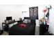The bedroom features carpet floors, a ceiling fan, and is decorated with a dragon-themed wall hanging at 146 Loblolly Ln, Davenport, FL 33837