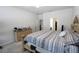 Bedroom featuring neutral walls and carpeting, access to a bathroom, and a walk-in closet at 146 Loblolly Ln, Davenport, FL 33837