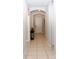 Hallway with neutral-colored walls and tile flooring that offers seamless transition and easy maintenance at 146 Loblolly Ln, Davenport, FL 33837