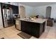 Modern kitchen with stainless steel appliances, granite countertops, and a large center island at 146 Loblolly Ln, Davenport, FL 33837