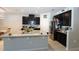 Modern kitchen featuring a center island, black cabinetry, and stainless steel appliances at 146 Loblolly Ln, Davenport, FL 33837