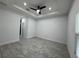 Spacious bedroom featuring a ceiling fan, tile flooring, and recessed lighting at 1476 11Th Ave, Deland, FL 32724