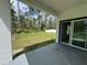 Covered patio view showcasing access to the backyard and providing an outdoor living space at 1476 11Th Ave, Deland, FL 32724
