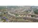 Aerial real estate photo showcases a neighborhood with green spaces and well-maintained homes at 1846 Galloway Ter, Winter Haven, FL 33881