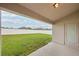 View of the backyard showcasing a well-maintained lawn and a white vinyl fence at 1846 Galloway Ter, Winter Haven, FL 33881