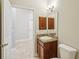 Bathroom features a traditional vanity and an open doorway to another room at 1846 Galloway Ter, Winter Haven, FL 33881