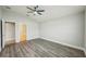 A large bedroom with tile floors, ceiling fan, and an ensuite bathroom for comfort at 1846 Galloway Ter, Winter Haven, FL 33881