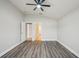 A bright bedroom with wood-look floors, neutral walls, and access to an ensuite bathroom at 1846 Galloway Ter, Winter Haven, FL 33881