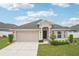 Well-maintained single-story home with a two-car garage, neat landscaping and inviting front entrance at 1846 Galloway Ter, Winter Haven, FL 33881