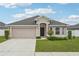Charming single-story home with a two-car garage and a well-manicured front yard at 1846 Galloway Ter, Winter Haven, FL 33881