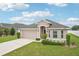 Well-maintained single-story home featuring lush landscaping, a two-car garage, and an inviting front entrance at 1846 Galloway Ter, Winter Haven, FL 33881
