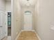 Bright foyer featuring neutral walls, ceramic tile flooring, and chandelier at 1846 Galloway Ter, Winter Haven, FL 33881