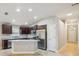 Bright kitchen with granite counters, stainless appliances, and a breakfast bar at 1846 Galloway Ter, Winter Haven, FL 33881