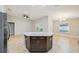 Kitchen island features granite countertops, stylish cabinets, and pendant lighting at 1846 Galloway Ter, Winter Haven, FL 33881
