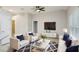 The living room is decorated with stylish furniture and a modern TV at 1846 Galloway Ter, Winter Haven, FL 33881