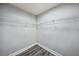 Empty walk-in closet featuring wire shelving and modern flooring at 1846 Galloway Ter, Winter Haven, FL 33881