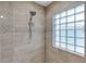Modern bathroom featuring tile walls, and a shower at 1940 Southern Dunes Blvd, Haines City, FL 33844