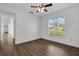 Bedroom features wood-look flooring and a large window allowing for ample natural light at 1940 Southern Dunes Blvd, Haines City, FL 33844