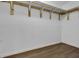 Spacious walk-in closet featuring wood-look floors and wooden fixtures providing a ready-to-organize space at 1940 Southern Dunes Blvd, Haines City, FL 33844