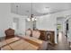 Formal dining room, hardwood floors, and stylish chandelier at 1940 Southern Dunes Blvd, Haines City, FL 33844