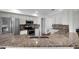 Well-equipped kitchen with stainless steel appliances, granite countertops, and a mosaic backsplash at 1940 Southern Dunes Blvd, Haines City, FL 33844