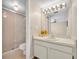 Bathroom featuring a shower with sliding door, a single sink vanity, and a neutral color palette at 200 Saint Andrews Blvd # 1603, Winter Park, FL 32792