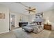 A primary bedroom featuring neutral colors, a king size bed, an area rug, and decor at 200 Saint Andrews Blvd # 1603, Winter Park, FL 32792