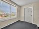 Entryway with a black carpet, door with unit number 1603, and a window showing the building's exterior at 200 Saint Andrews Blvd # 1603, Winter Park, FL 32792