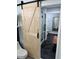Modern bathroom featuring a sliding barn door, walk-in shower, and sleek finishes for a luxurious experience at 2035 Dixie Belle Dr # 2035C, Orlando, FL 32812