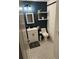 Modern bathroom boasting a stylish vanity, updated fixtures, and trendy black and white patterned flooring at 2035 Dixie Belle Dr # 2035C, Orlando, FL 32812