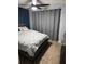 Comfortable bedroom with large windows, cozy carpet, and ceiling fan at 2035 Dixie Belle Dr # 2035C, Orlando, FL 32812