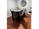 A dining room with wood flooring, a table with 4 chairs, and natural light at 2035 Dixie Belle Dr # 2035C, Orlando, FL 32812