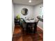 Dining area with wood floors, black table and comfortable chairs at 2035 Dixie Belle Dr # 2035C, Orlando, FL 32812
